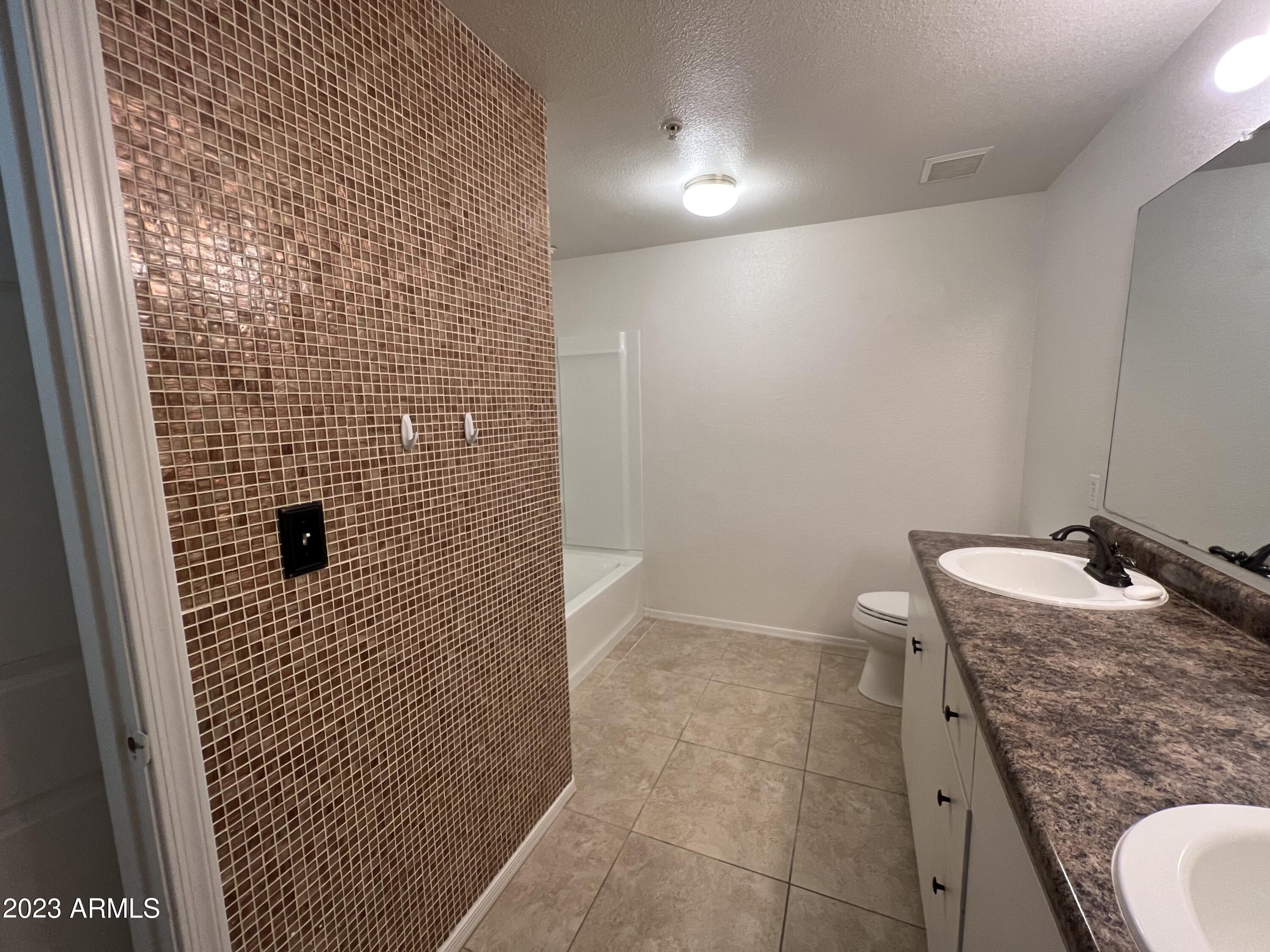 18416 North Cave Creek Road, Unit 1059 Phoenix, AZ 85032 - Photo 26 of 45 Decorative Tile Wall