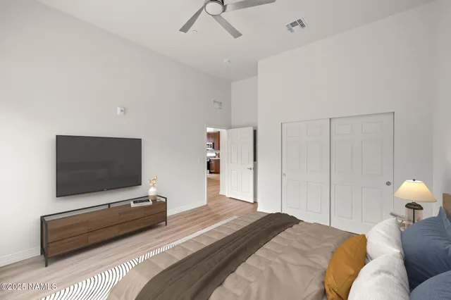 a bedroom with a bed and a window