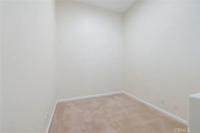 an empty room with a fireplace