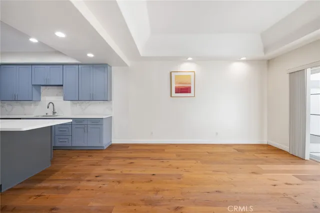 a view of kitchen and wooden floor