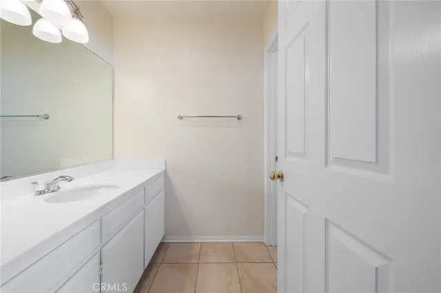 a white toilet sitting next to a bathroom sink