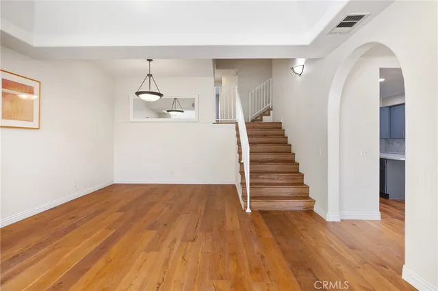 wooden floor in an empty room with a gallery