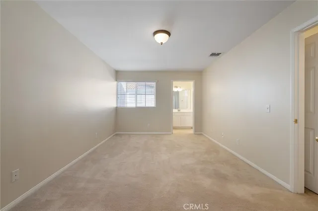 a view of a house with wooden fence