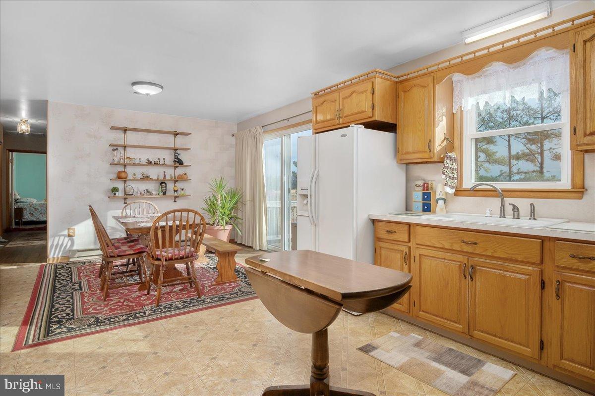 151 Tenderheart Lane Falling Waters, WV 25419 - Photo 12 of 55 Bright and inviting kitchen with rustic charm.