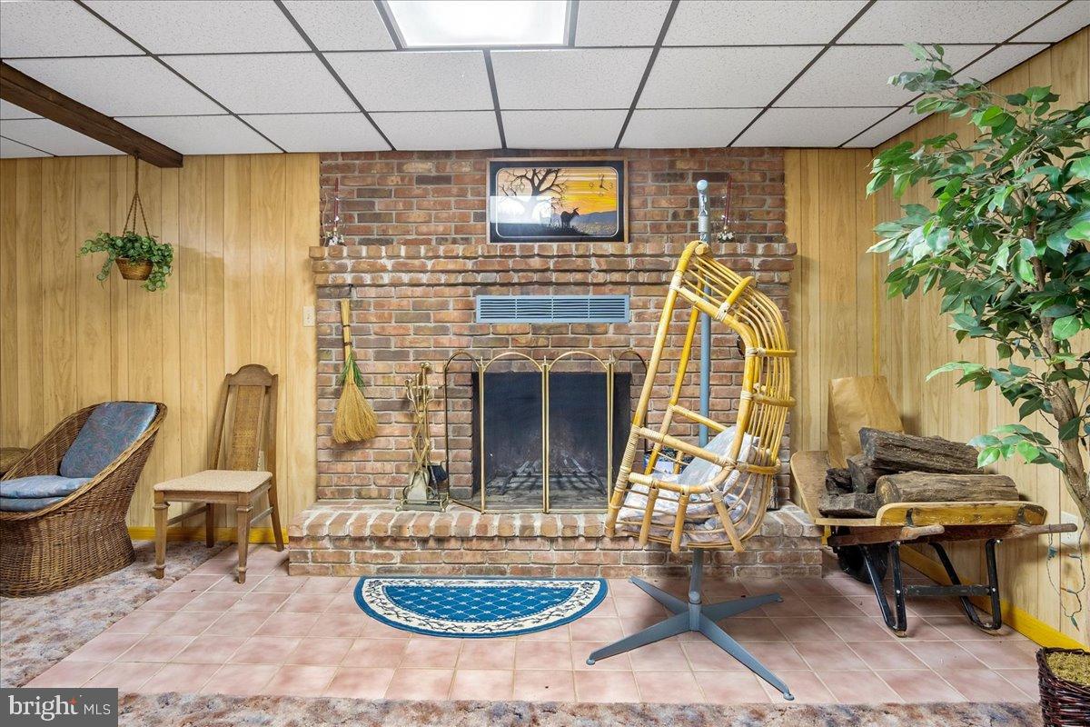 151 Tenderheart Lane Falling Waters, WV 25419 - Photo 21 of 55 Cozy basement retreat with rustic charm.