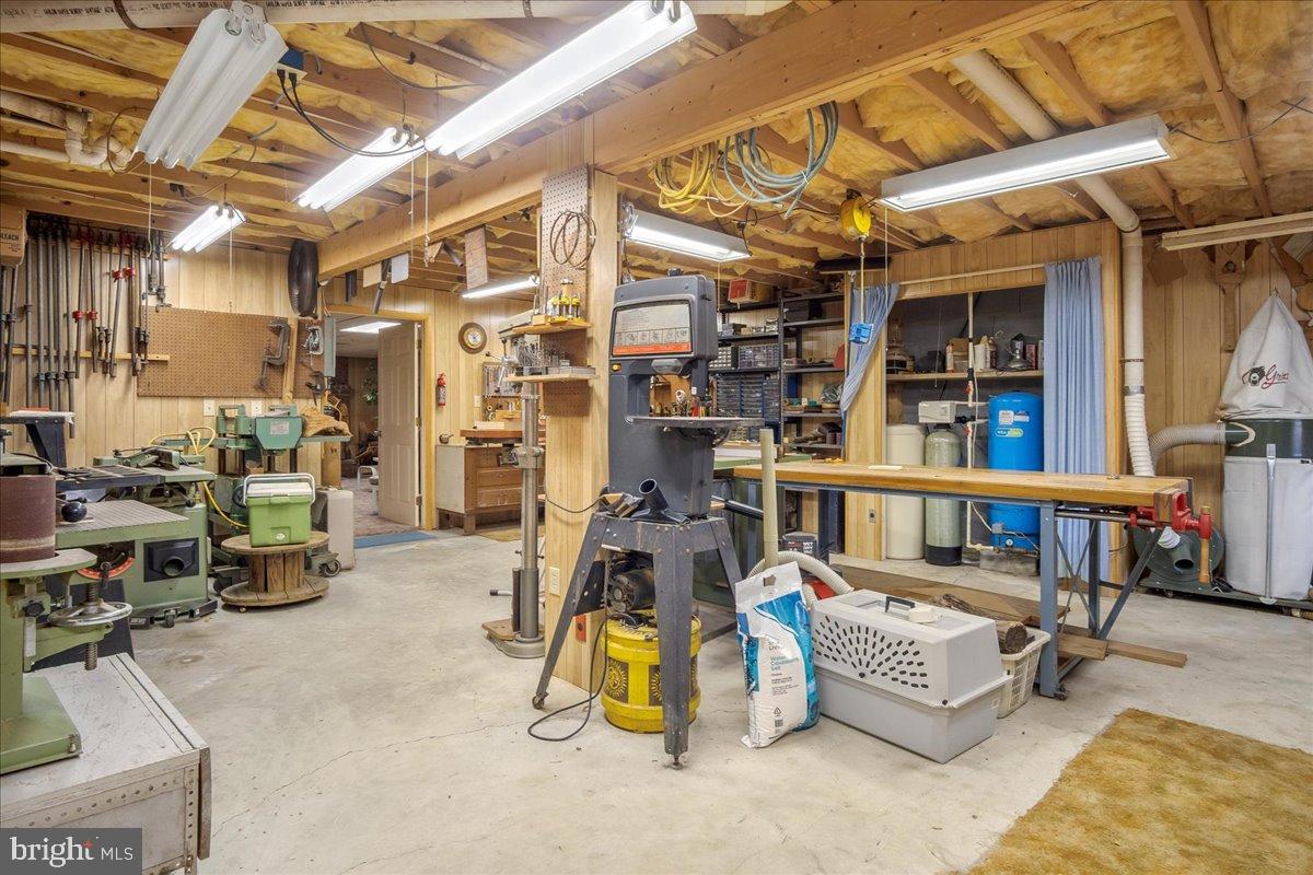 151 Tenderheart Lane Falling Waters, WV 25419 - Photo 28 of 55 Spacious workshop with ample tools and light.