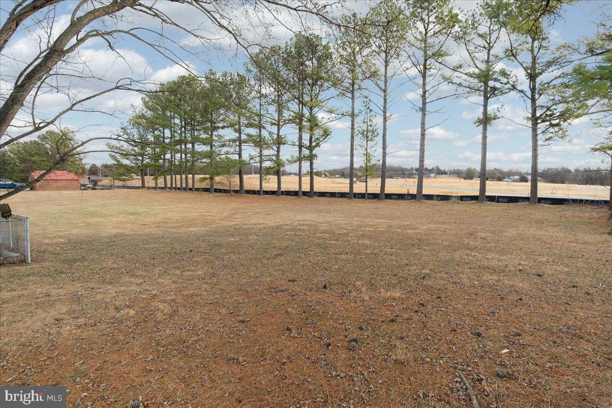 151 Tenderheart Lane Falling Waters, WV 25419 - Photo 35 of 55 Spacious lot with serene tree line backdrop.