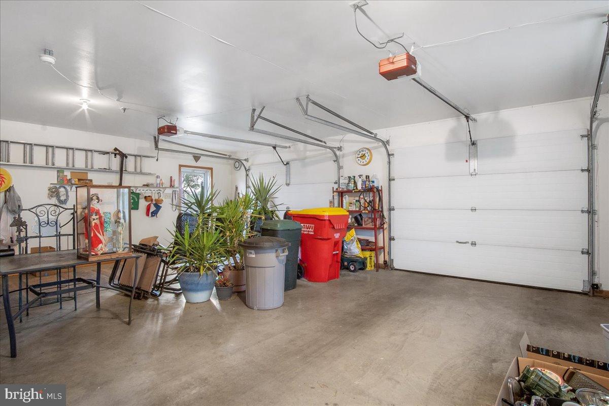 151 Tenderheart Lane Falling Waters, WV 25419 - Photo 42 of 55 Spacious garage with ample storage options.