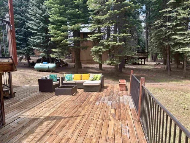 a view of a balcony with wooden floor