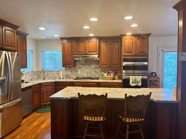a living room with furniture rug and window