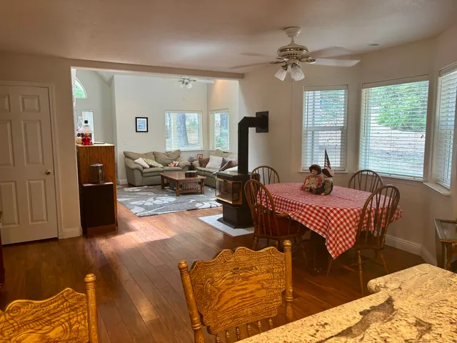 a kitchen with stainless steel appliances granite countertop wooden cabinets and a sink