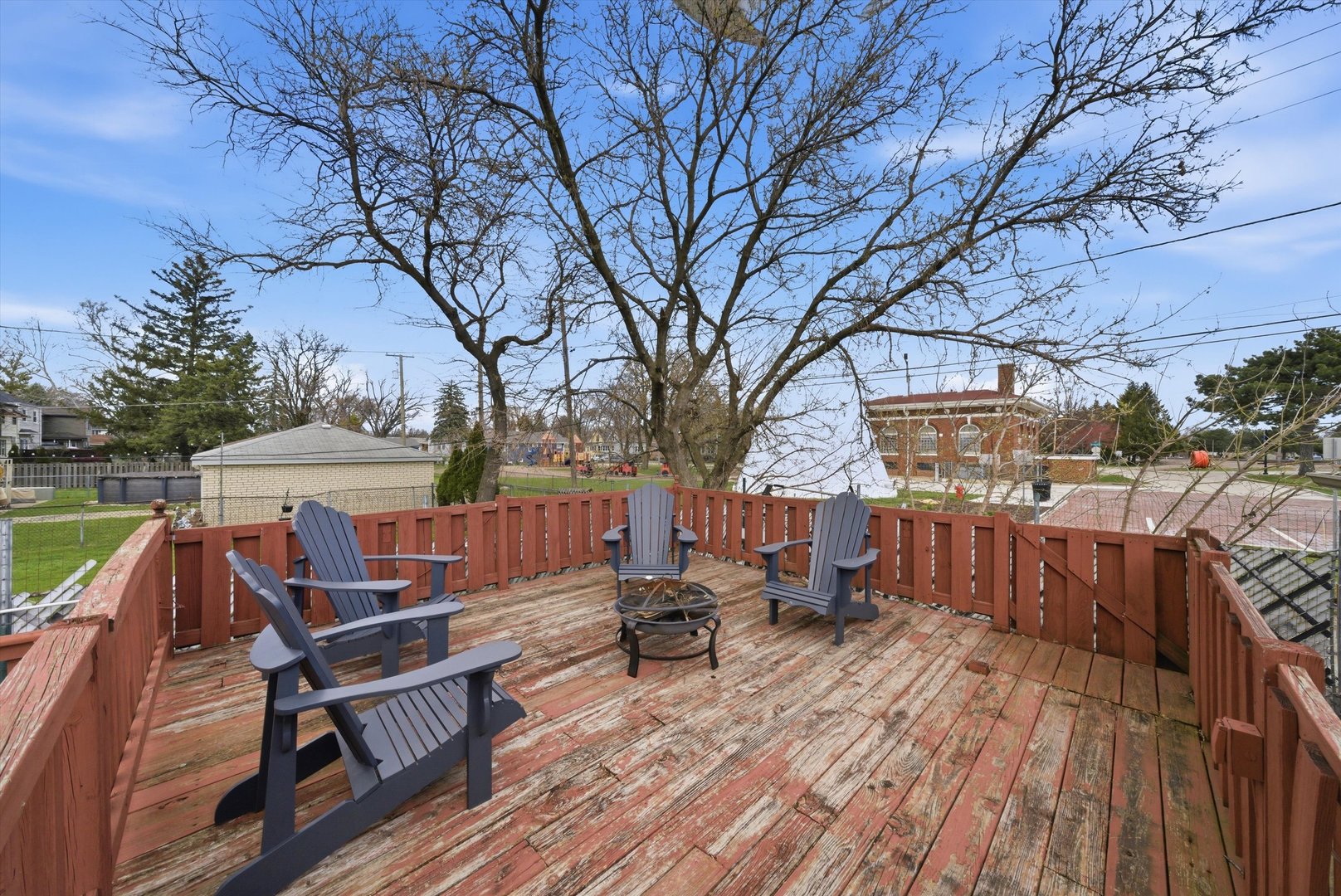 3841 Arthur Avenue Brookfield, IL 60513 - Photo 26 of 34 a view of a roof deck with table and chairs a barbeque with wooden floor and fence