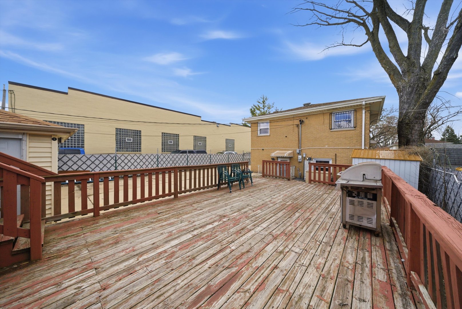 3841 Arthur Avenue Brookfield, IL 60513 - Photo 27 of 34 a view of a house with wooden deck and a barbeque