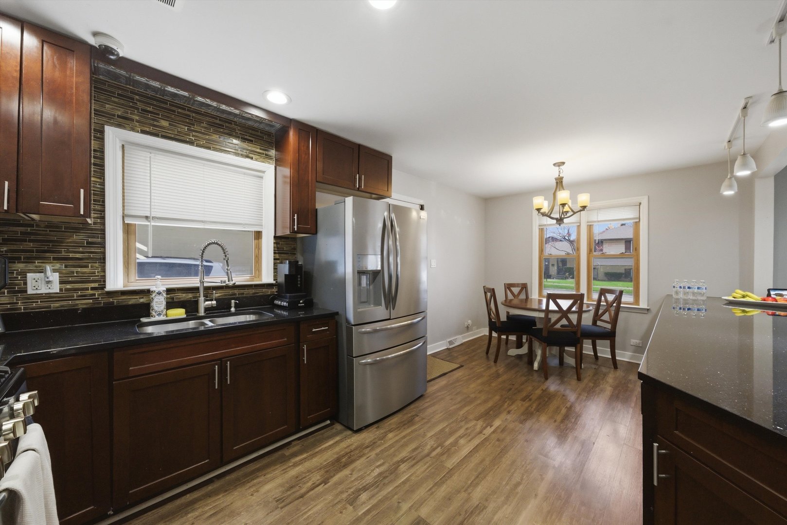 3841 Arthur Avenue Brookfield, IL 60513 - Photo 10 of 34 a kitchen with granite countertop a sink stove and refrigerator