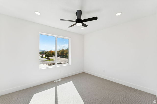 252 North Main Street Bountiful, UT 84010 - Photo 21 of 34 Spare room with carpet floors, a ceiling fan, and recessed lighting