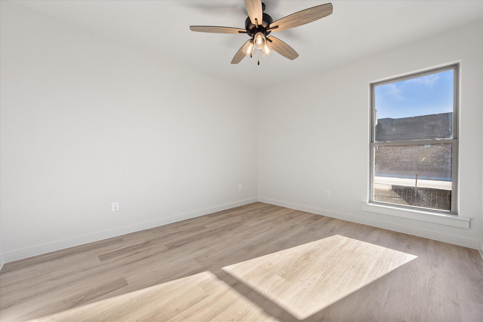 6927 53rd Street Lubbock, TX 79407 - Photo 16 of 21 an empty room with a window