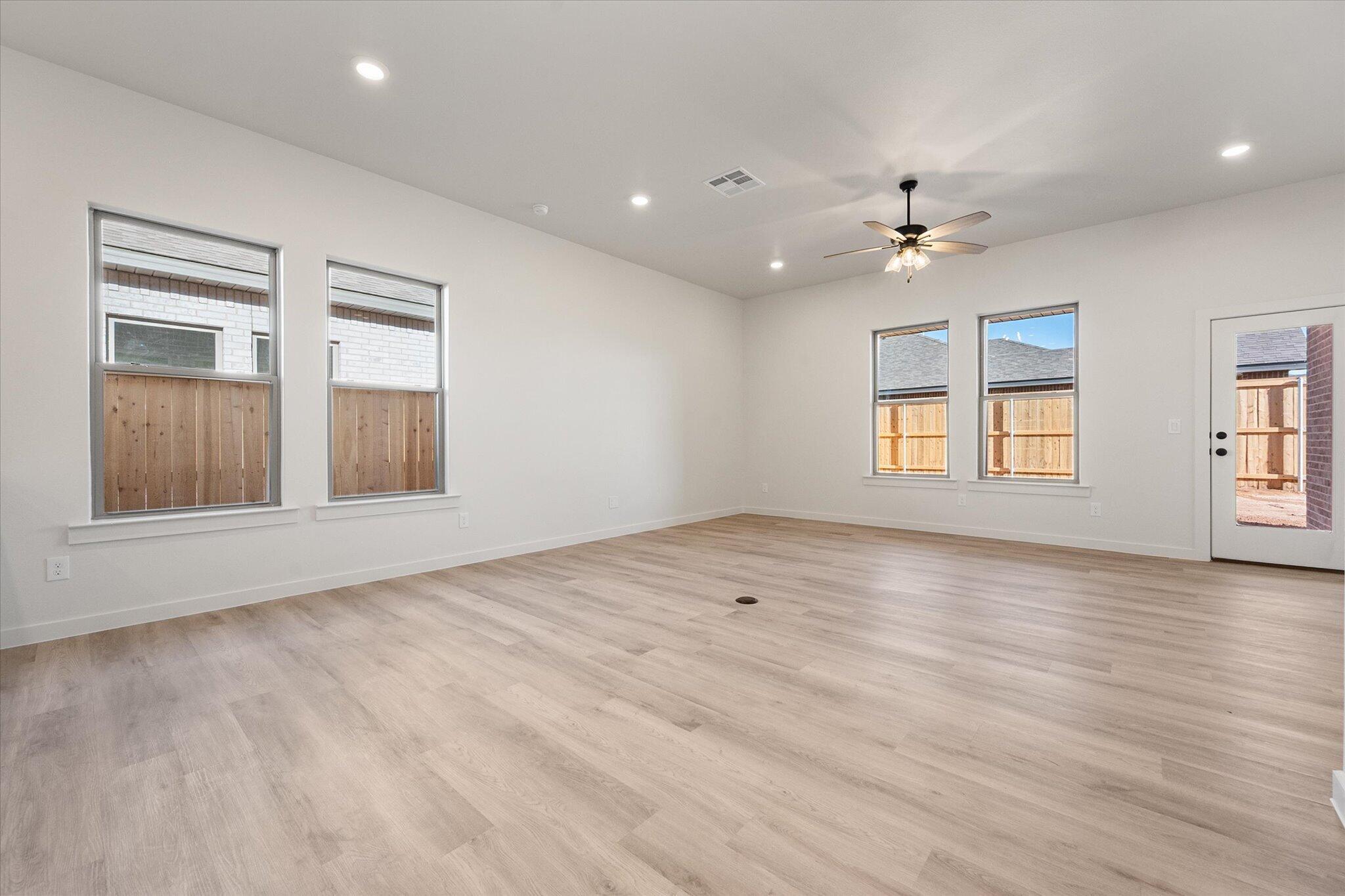 6927 53rd Street Lubbock, TX 79407 - Photo 10 of 21 a view of an empty room with a window and closet area
