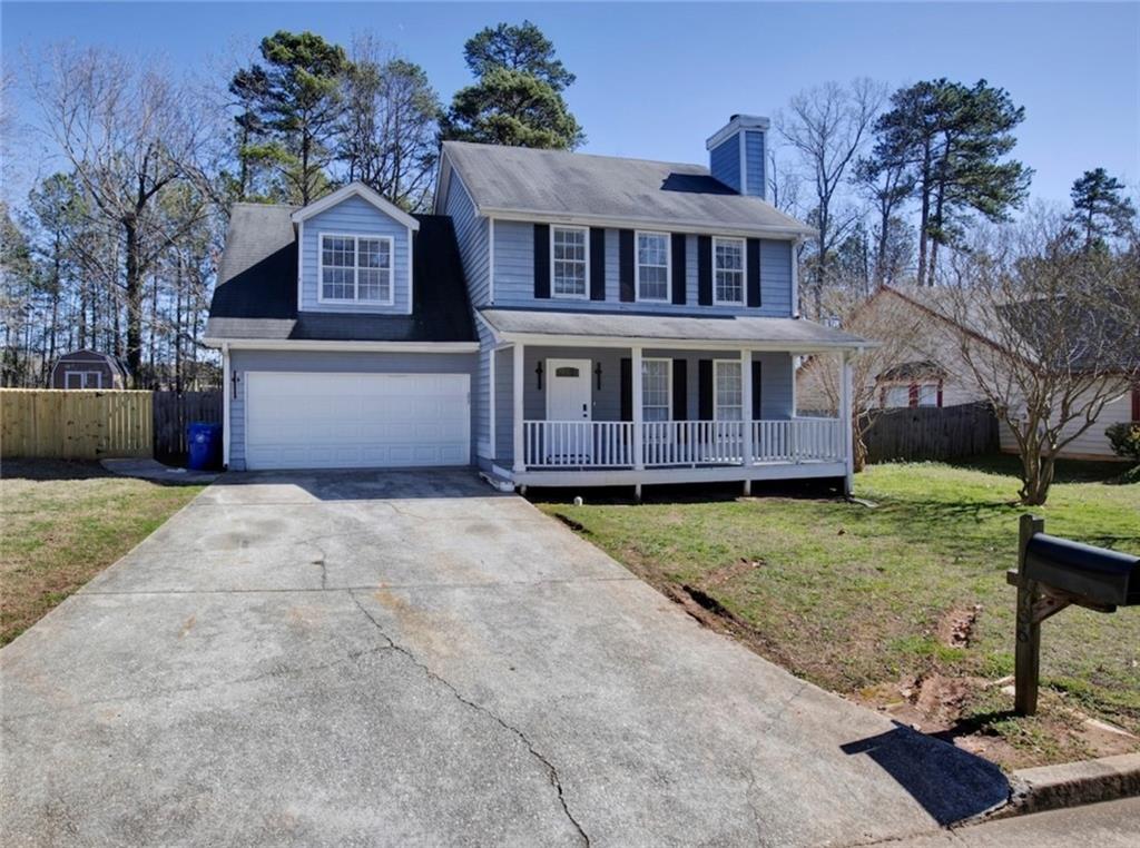 736 Stephenson Ridge Stone Mountain, GA 30087 - Photo 1 of 1 a front view of a house with a yard