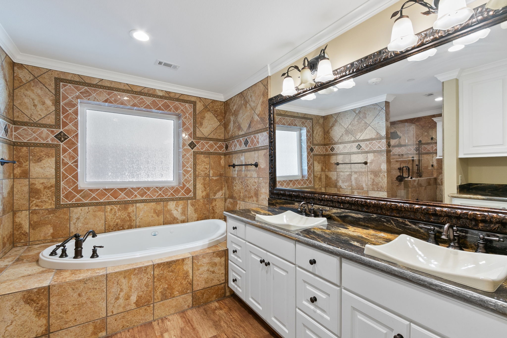 17018 Grant Road Cypress, TX 77429 - Photo 8 of 50 a bathroom with a tub sink and mirror