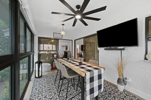 a view of a livingroom with furniture and a flat screen tv