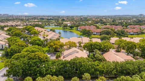 an aerial view of lake residential houses with outdoor space and swimming pool