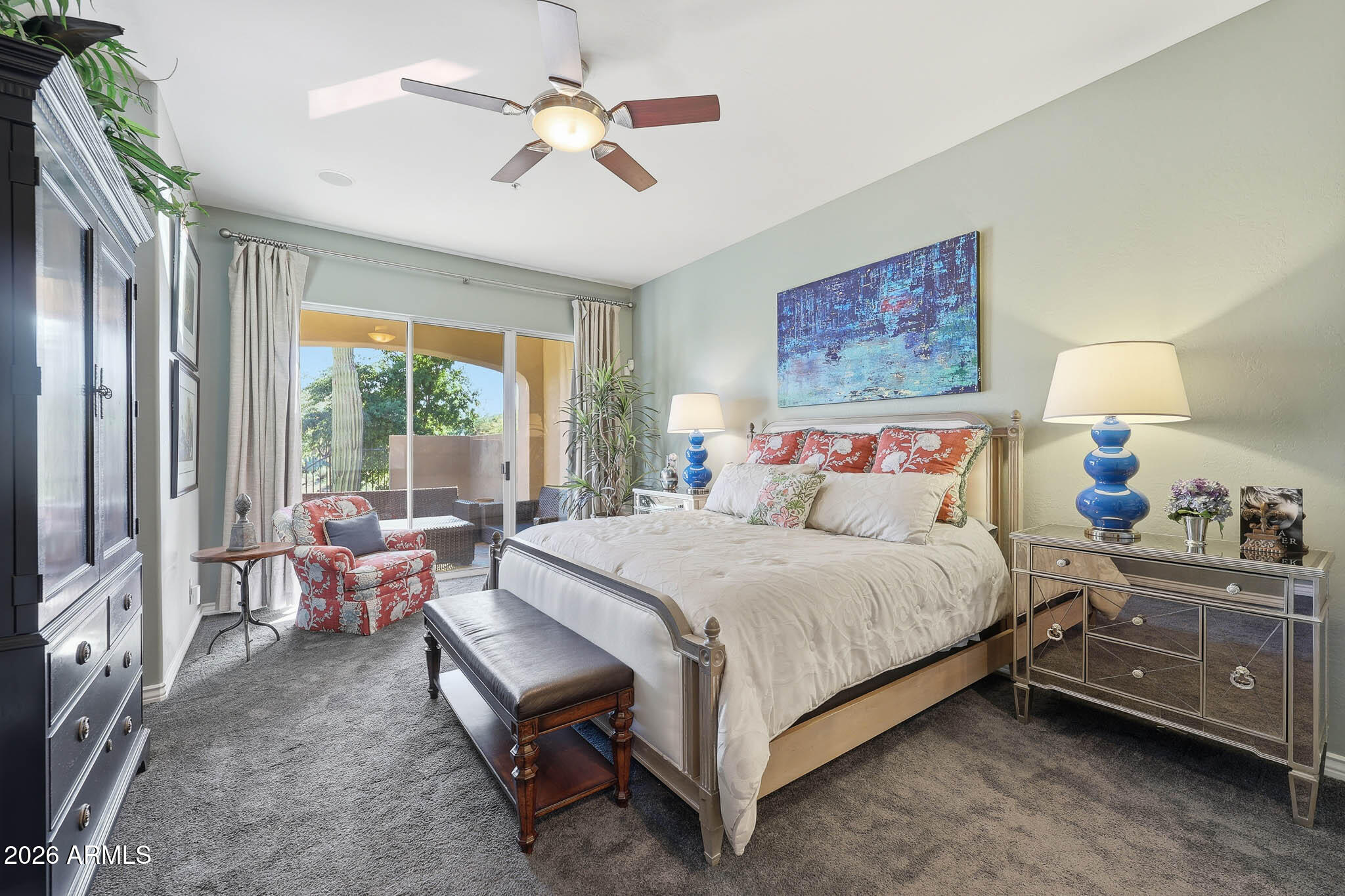 8891 East Mountain Spring Road Scottsdale, AZ 85255 - Photo 17 of 33 a bedroom with a bed and a chandelier