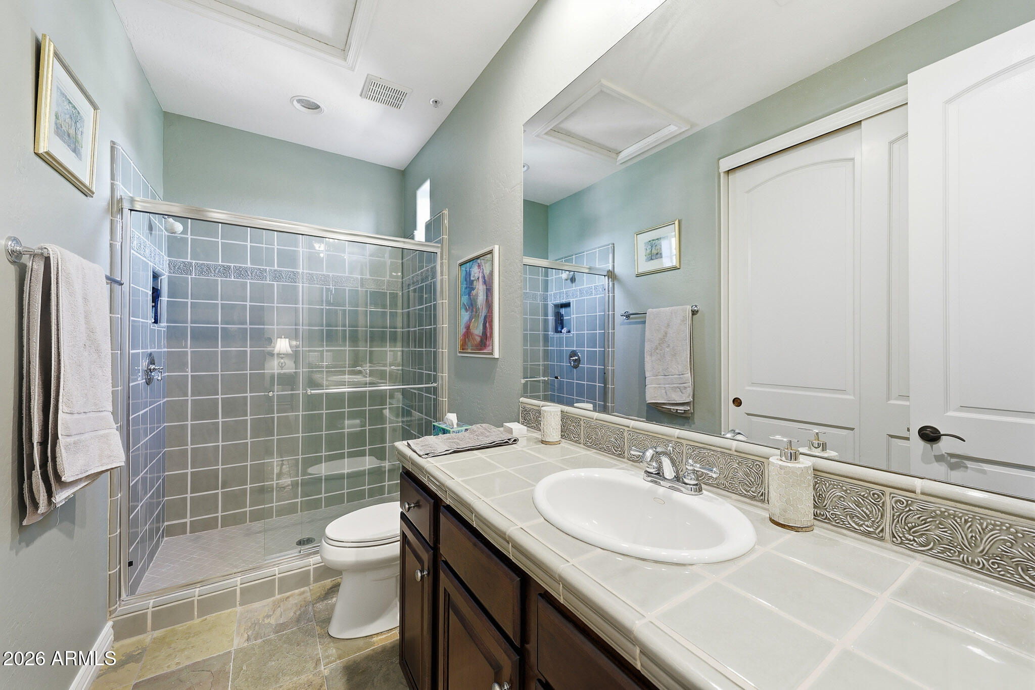 8891 East Mountain Spring Road Scottsdale, AZ 85255 - Photo 24 of 33 a bathroom with a double vanity sink toilet and shower