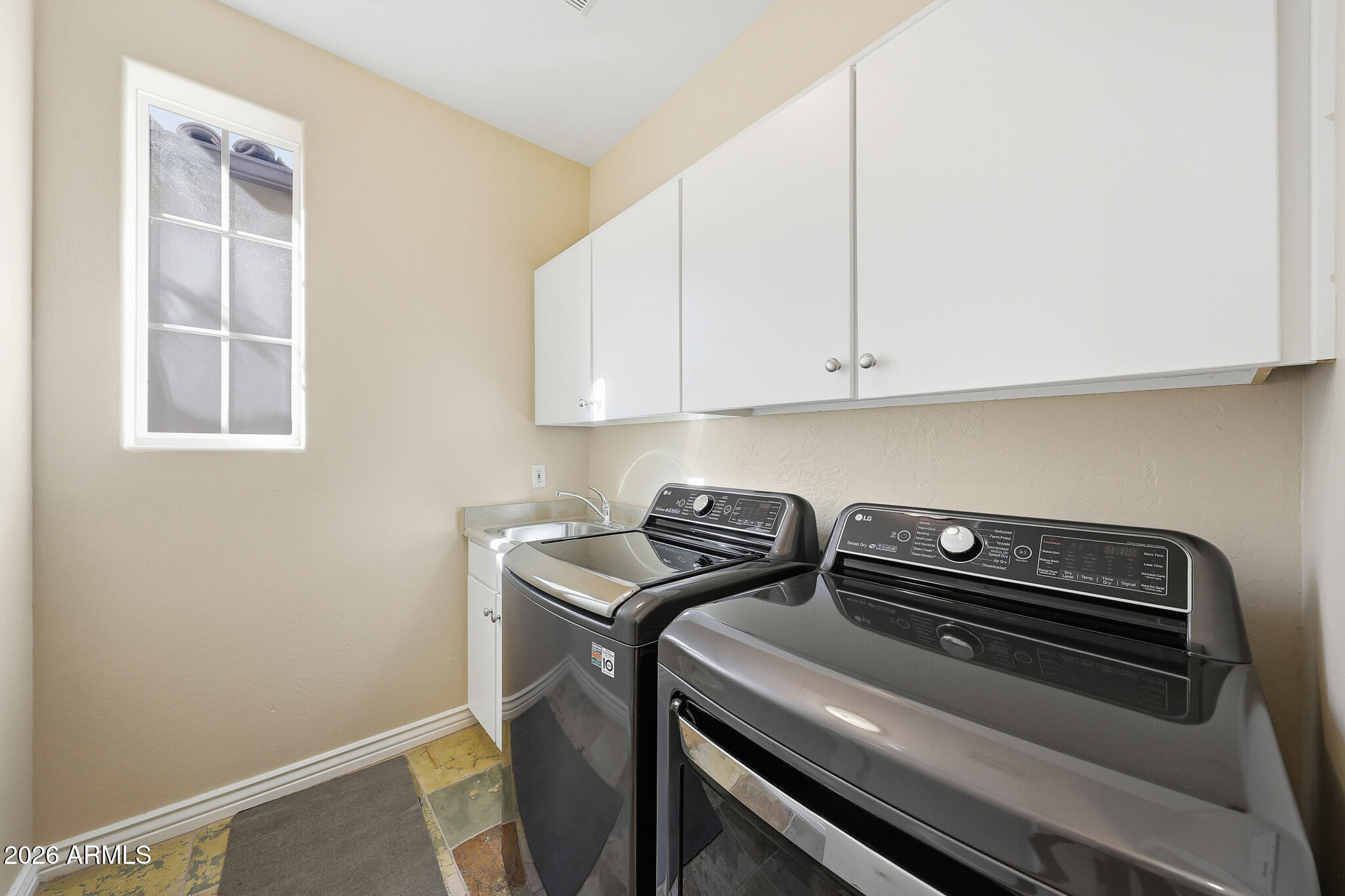 8891 East Mountain Spring Road Scottsdale, AZ 85255 - Photo 26 of 33 a utility room with dryer and washer