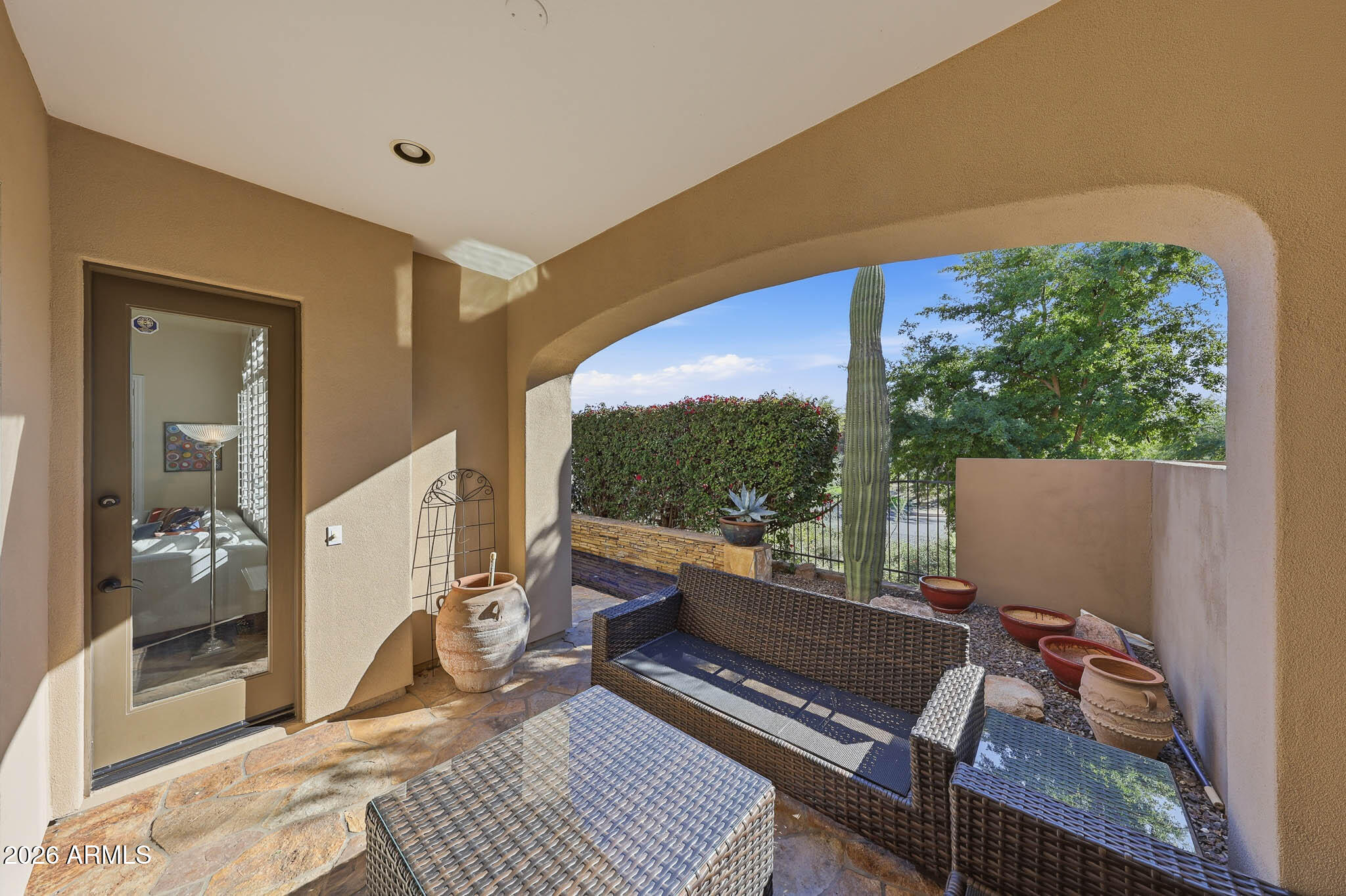 8891 East Mountain Spring Road Scottsdale, AZ 85255 - Photo 30 of 33 a balcony with wooden floor and outdoor seating