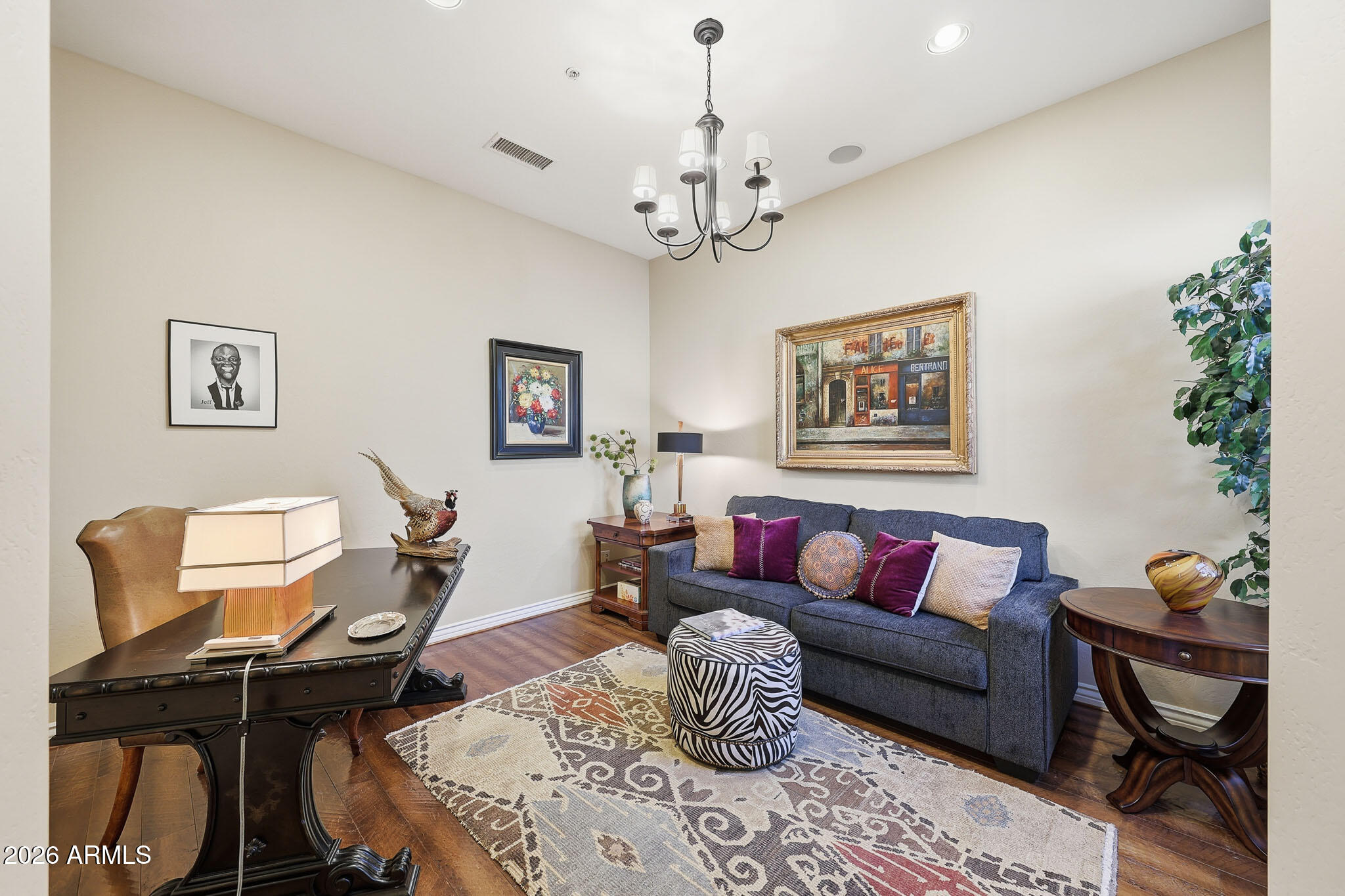 8891 East Mountain Spring Road Scottsdale, AZ 85255 - Photo 4 of 33 a living room with furniture a chandelier and a window