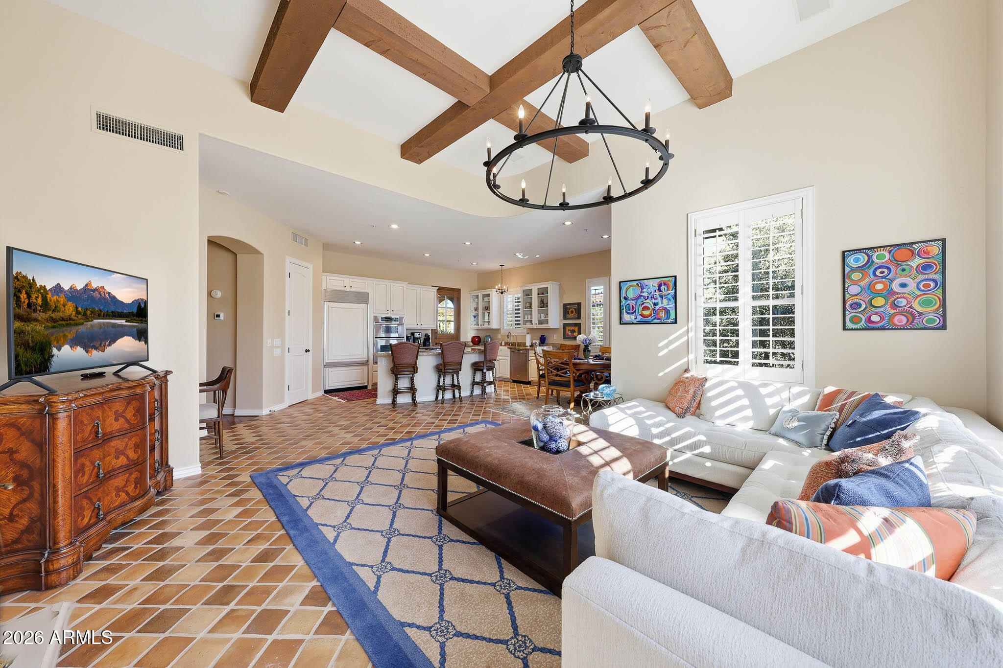 8891 East Mountain Spring Road Scottsdale, AZ 85255 - Photo 7 of 33 a living room with furniture a flat screen tv and a window