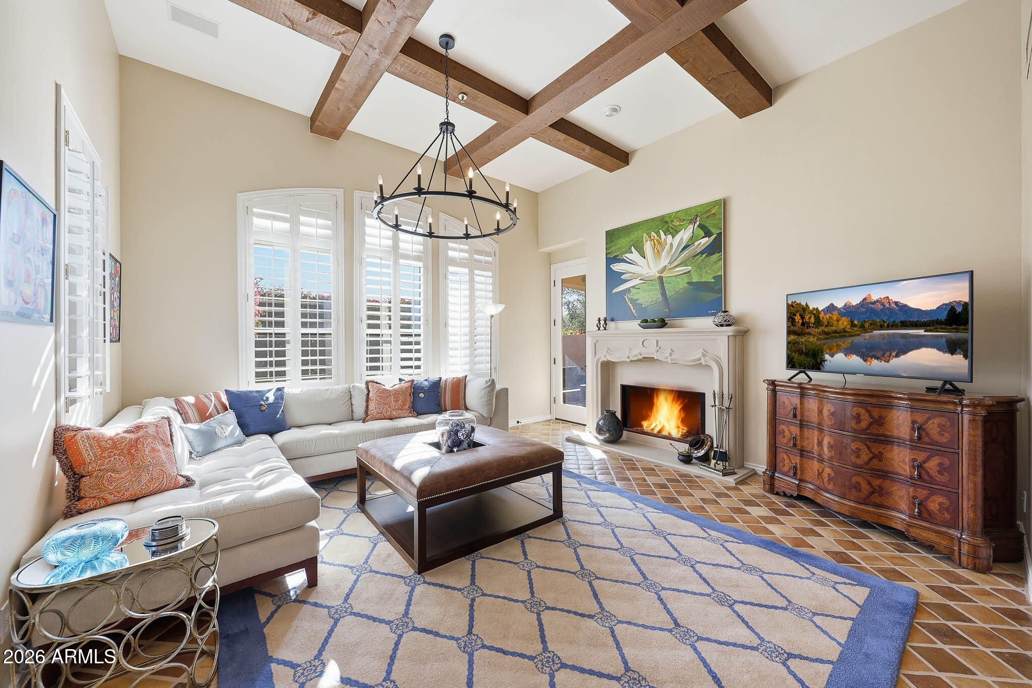 8891 East Mountain Spring Road Scottsdale, AZ 85255 - Photo 8 of 33 a living room with furniture a fireplace and a flat screen tv