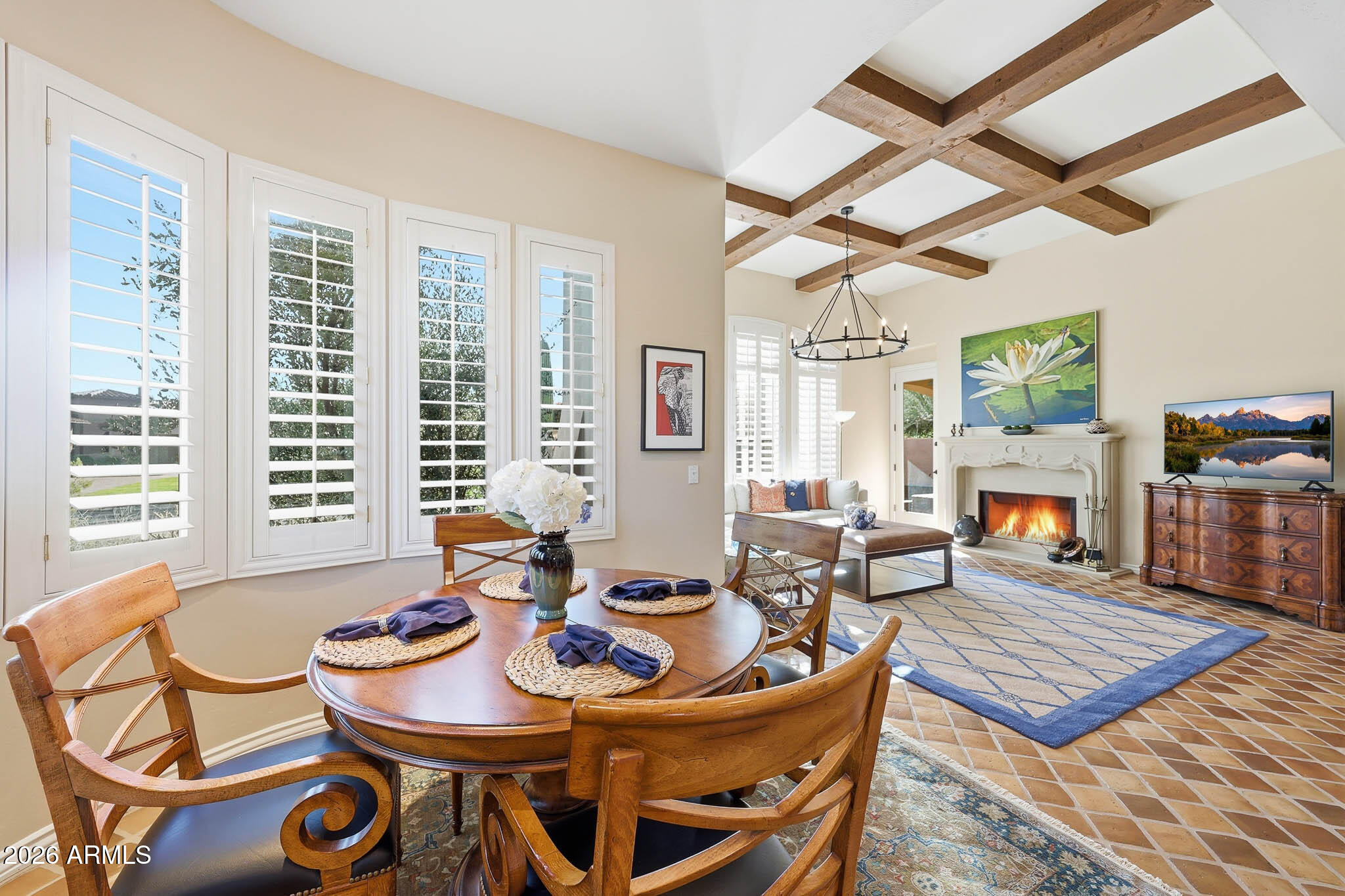 8891 East Mountain Spring Road Scottsdale, AZ 85255 - Photo 9 of 33 a living room with furniture a flat screen tv and a table