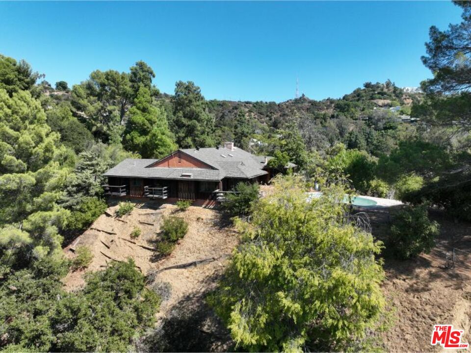9595 Lime Orchard Road Beverly Hills, CA 90210 - Photo 11 of 12 a view of a small house with a yard