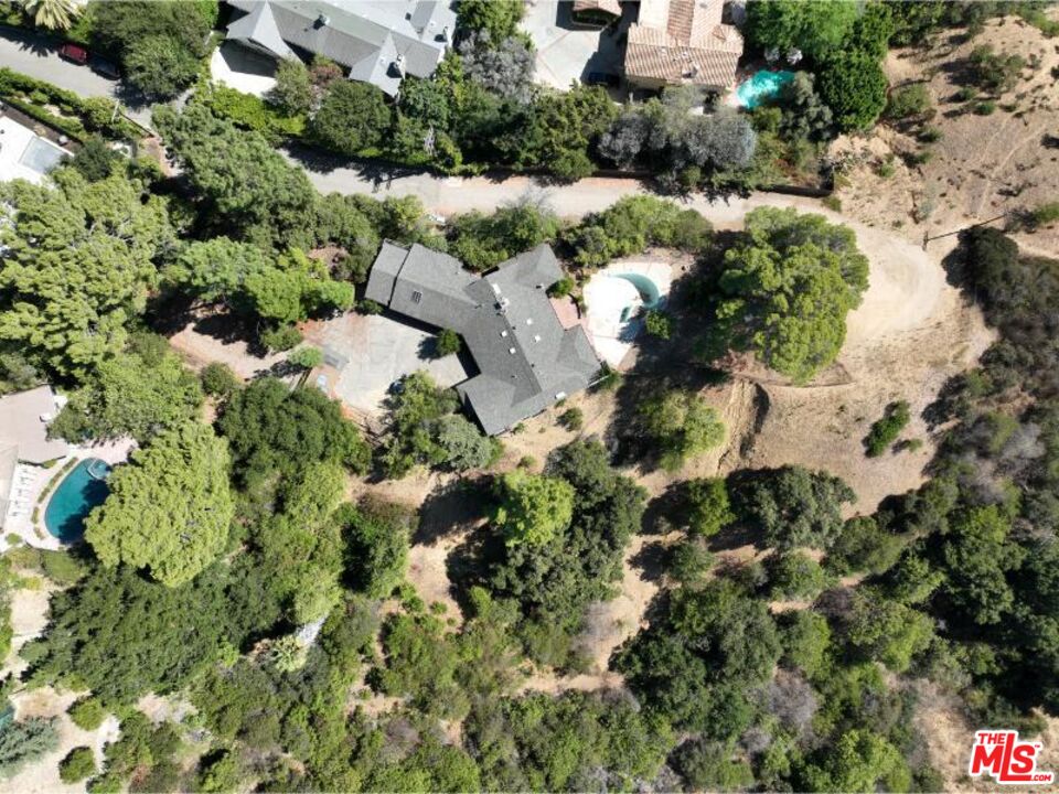 9595 Lime Orchard Road Beverly Hills, CA 90210 - Photo 7 of 12 an aerial view of a house with a yard and large trees