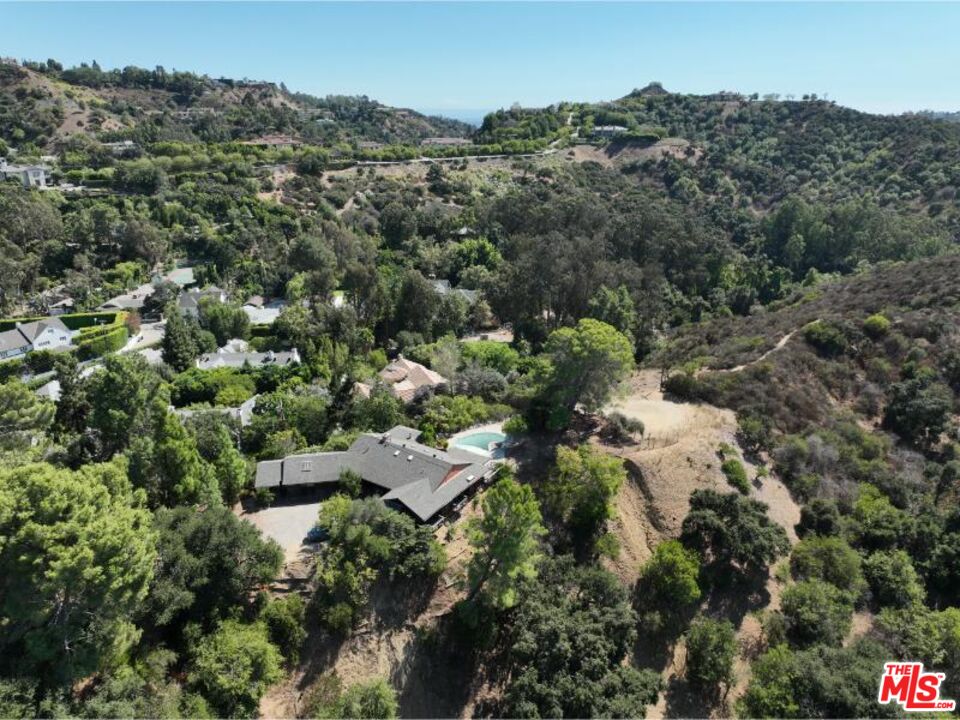 9595 Lime Orchard Road Beverly Hills, CA 90210 - Photo 8 of 12 an aerial view of residential house with outdoor space and trees all around