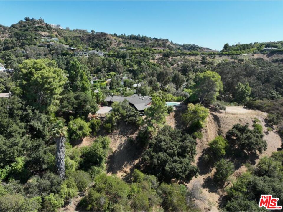9595 Lime Orchard Road Beverly Hills, CA 90210 - Photo 10 of 12 an aerial view of residential house with outdoor space and trees all around