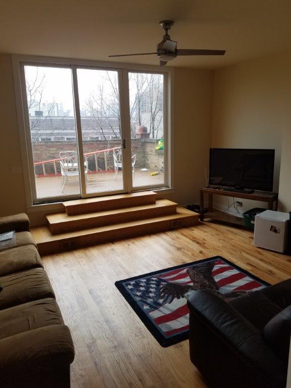 1418 North Mohawk Street, Unit 3S Chicago, IL 60610 - Photo 9 of 15 a bedroom with furniture and a flat screen tv