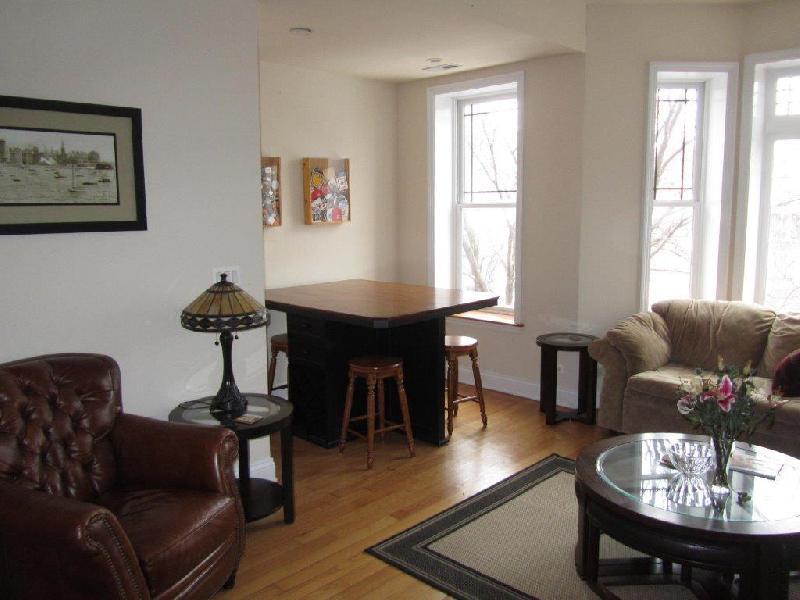 1418 North Mohawk Street, Unit 3S Chicago, IL 60610 - Photo 10 of 15 a living room with furniture and wooden floor