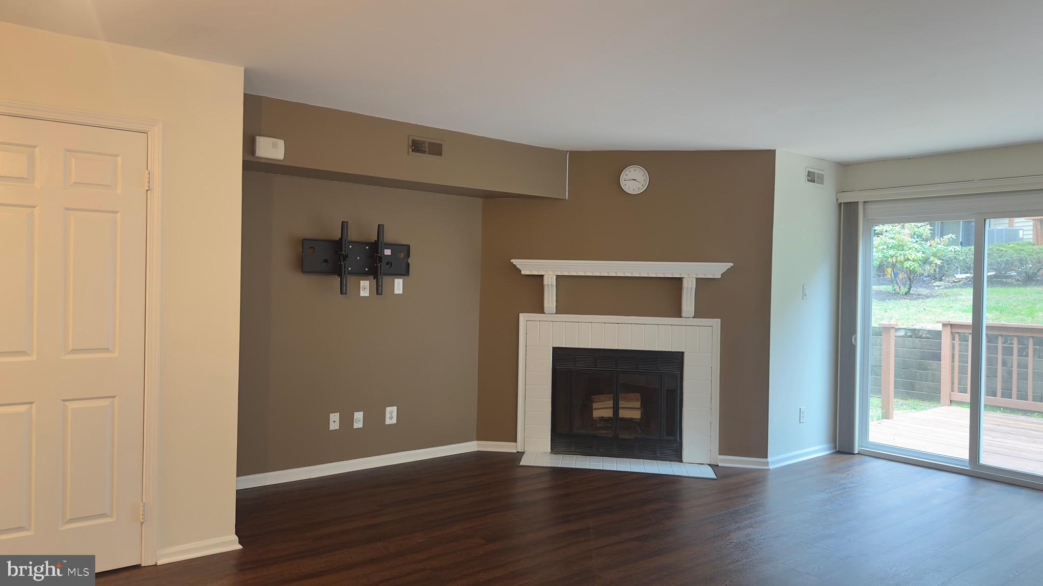 342 Brigade Court, Unit 342 Chesterbrook, PA 19087 - Photo 4 of 16 a view of a livingroom with wooden floor and a fireplace