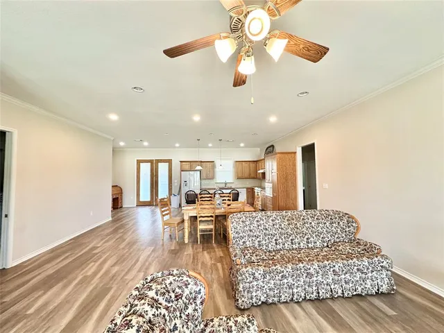 a living room with furniture and a chandelier