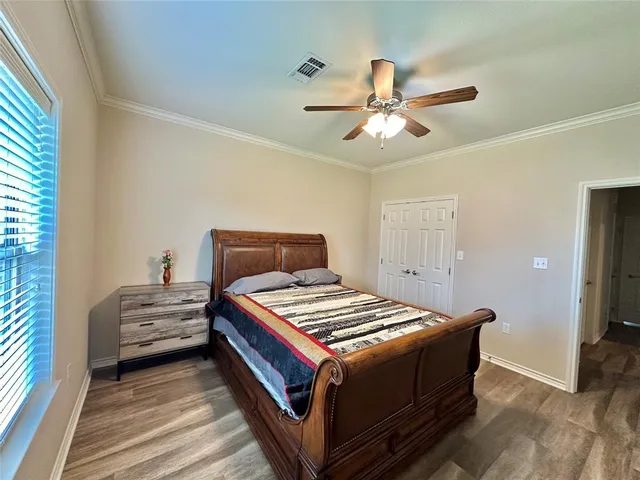 a bedroom with a bed and window