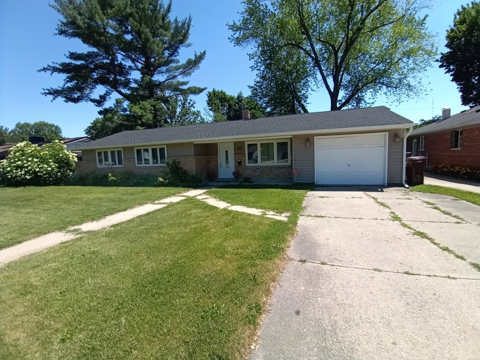 4115 Highcrest Road Rockford, IL 61107 - Photo 1 of 26 a house view with a sitting space and garden