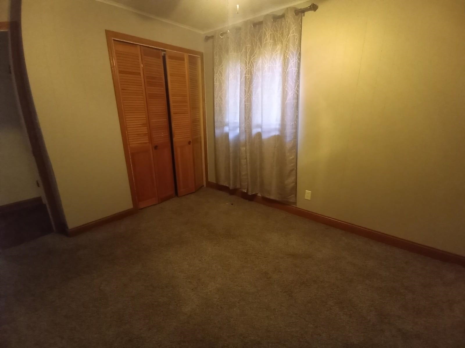 4115 Highcrest Road Rockford, IL 61107 - Photo 9 of 26 an empty room with windows
