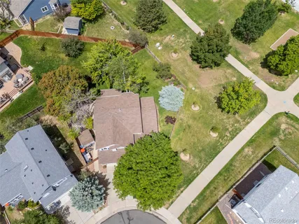 an aerial view of a residential houses with outdoor space