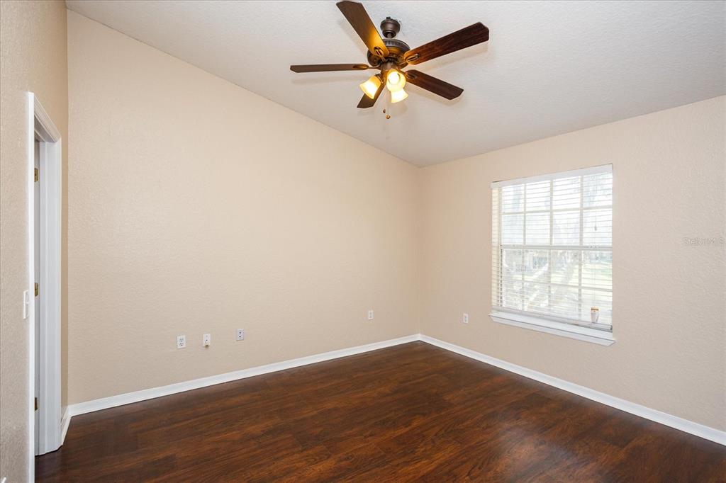 819 Grand Regency Pointe, Unit 203 Altamonte Springs, FL 32714 - Photo 14 of 21 an empty room with wooden floor and windows