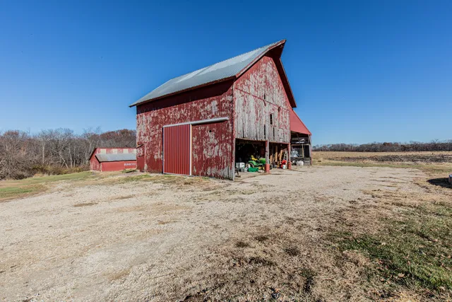 an aerial view of a house with yard ocean and mountain view