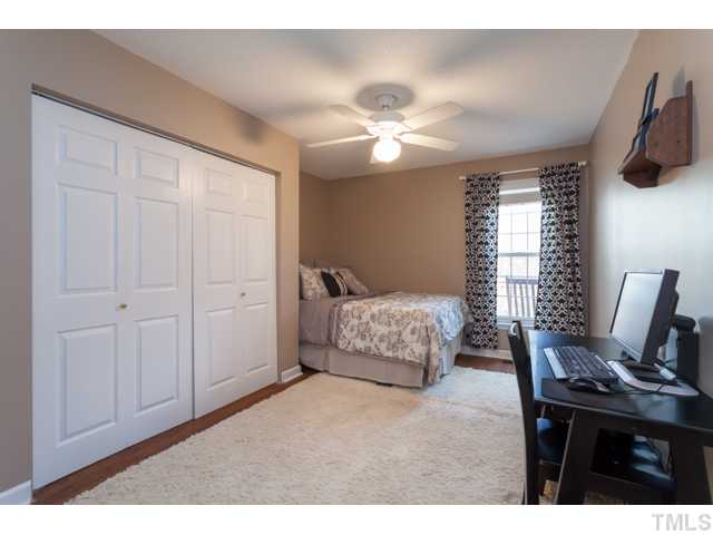 4521 Hershey Court Raleigh, NC 27613 - Photo 15 of 24 a bedroom with a bed and furniture