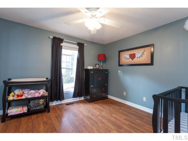 4521 Hershey Court Raleigh, NC 27613 - Photo 17 of 24 a living room with furniture and a flat screen tv