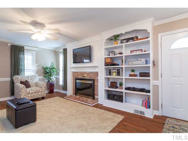 4521 Hershey Court Raleigh, NC 27613 - Photo 4 of 24 a living room with furniture and a fireplace